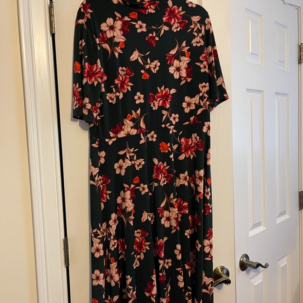 Midi length, a-line turtleneck short sleeve dress with floral design